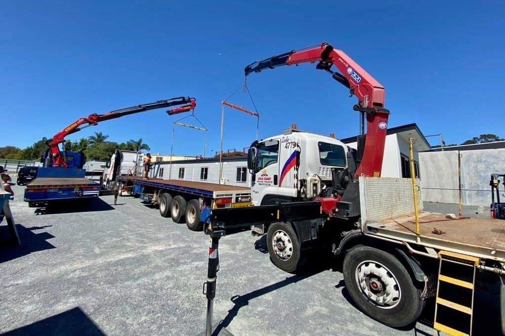 3 Crane Trucks Working Together